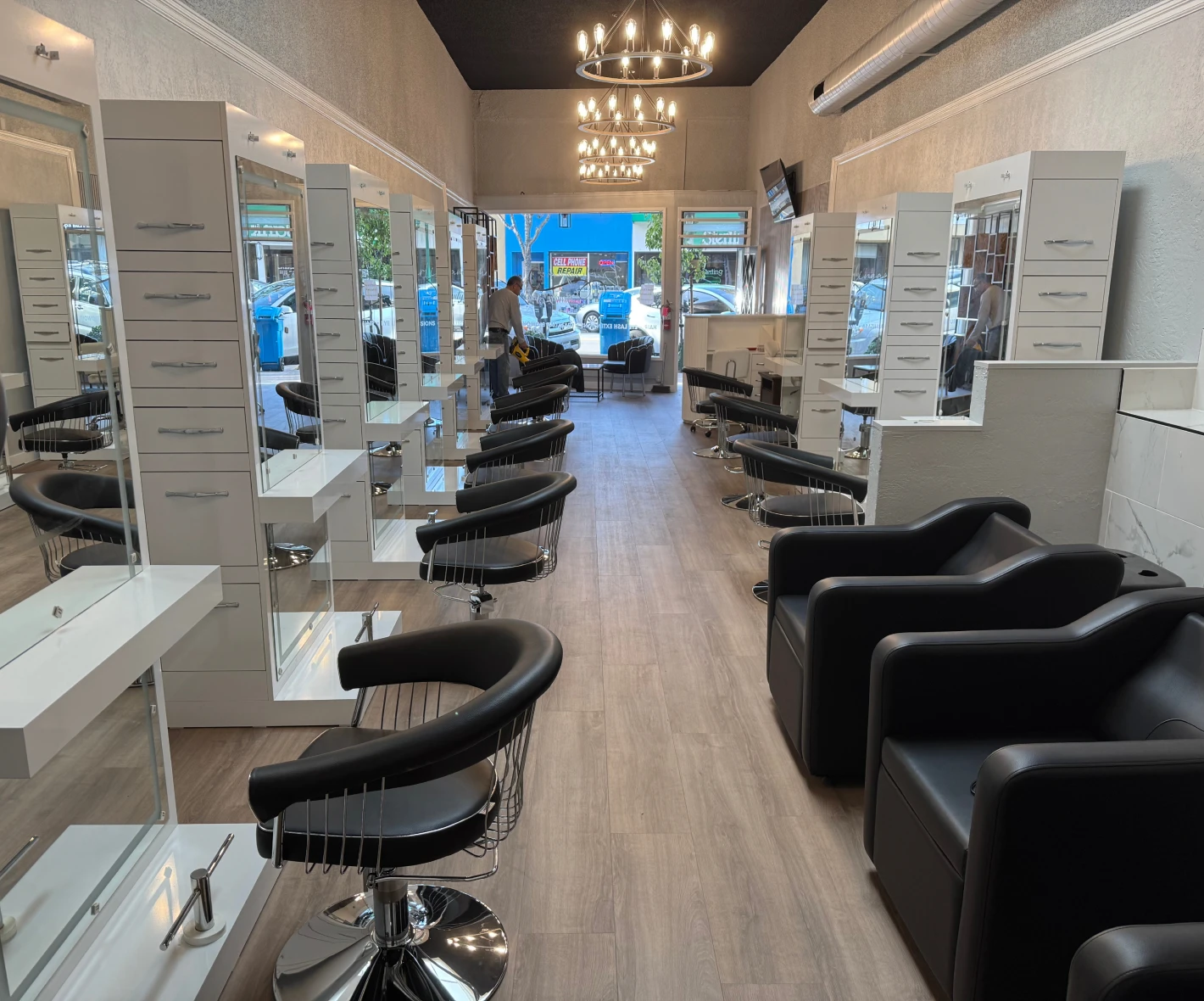 Elegant salon setup with chandeliers and seating